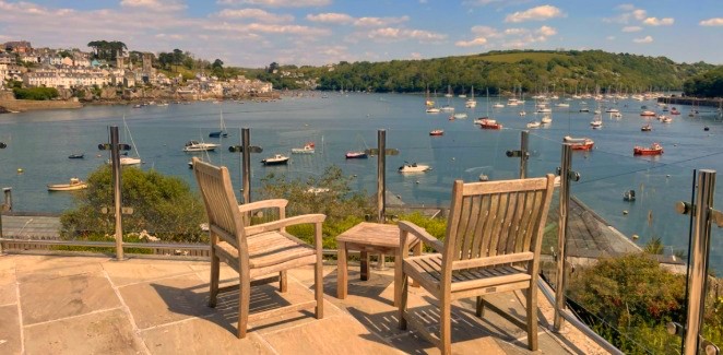 Charlotte and Rose's home — a terrace overlooking a Cornish harbour full of boats